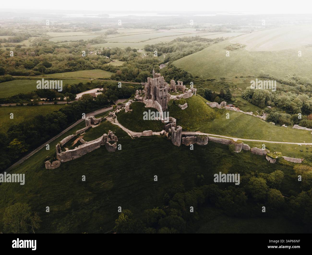 Aerial view of a historic castle surrounded by scenic countryside and ...