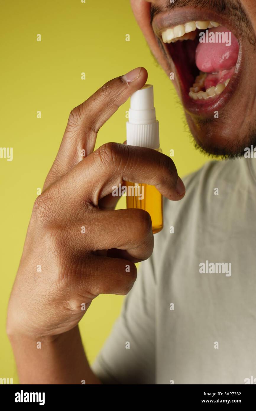 Using Mouth Spray Mouth spray hi-res stock photography and images - Alamy