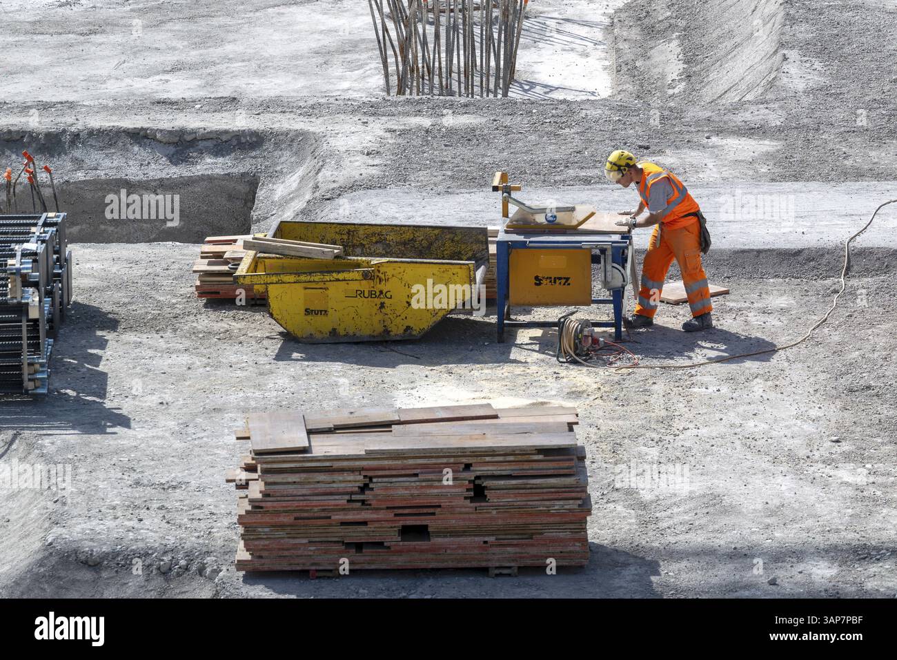 Construction site Construction worker Circular saw Stock Photo