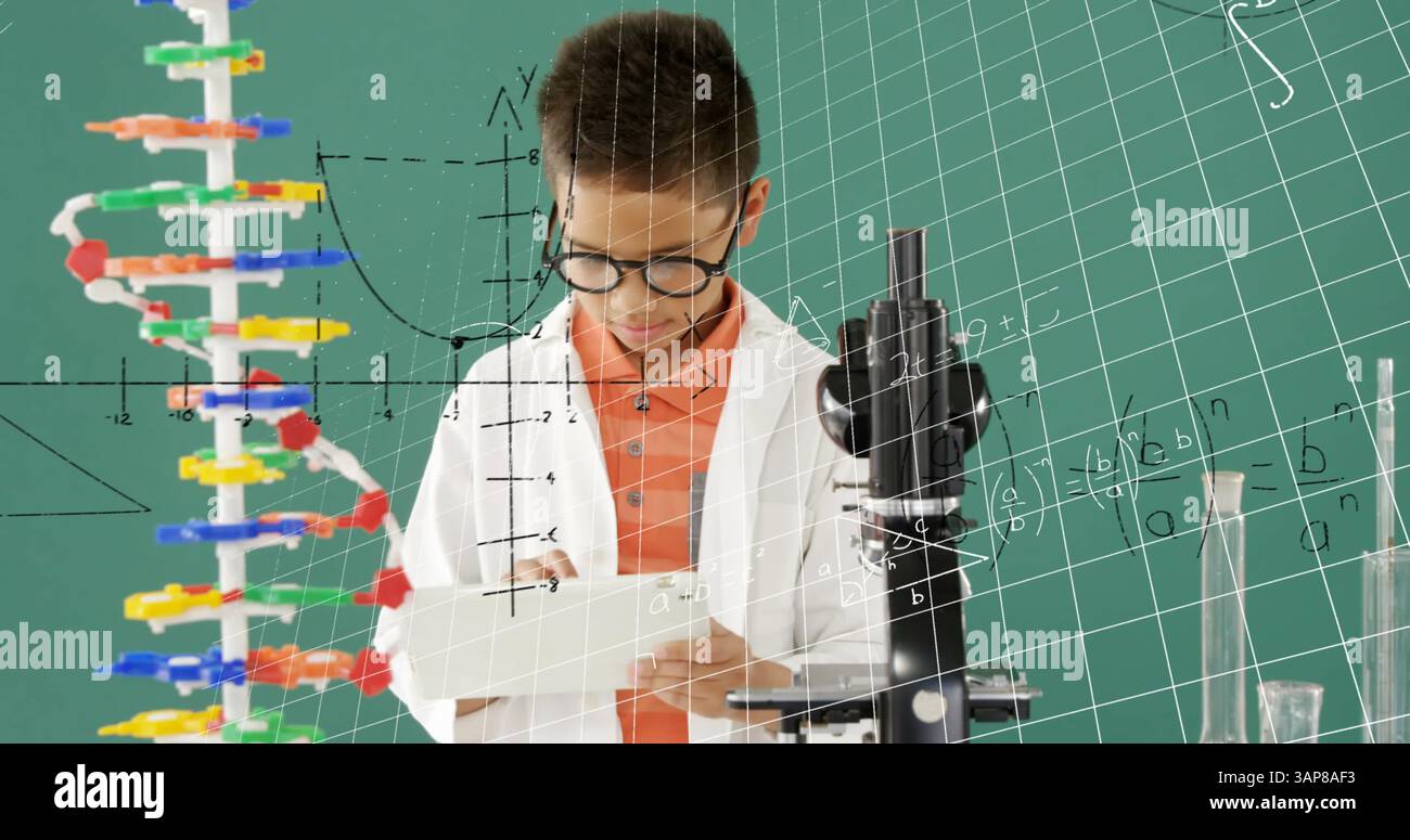 Image of mathematical formulae over smiling schoolboy using tablet Stock Photo