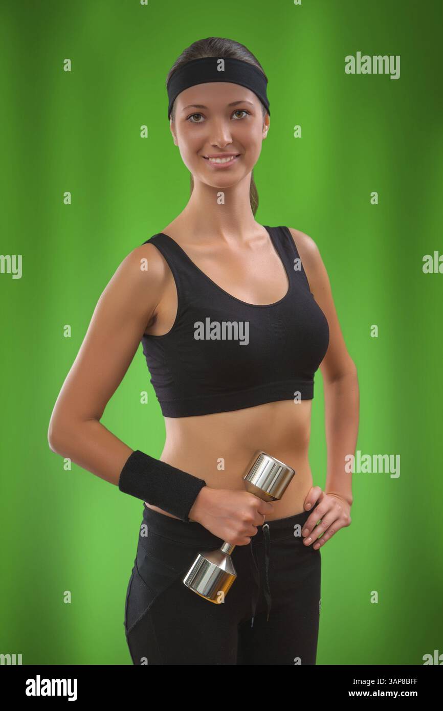 A sports girl on green background Stock Photo - Alamy