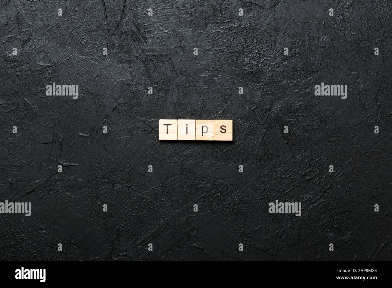 tips word written on wood block. tips text on table, concept. Stock Photo