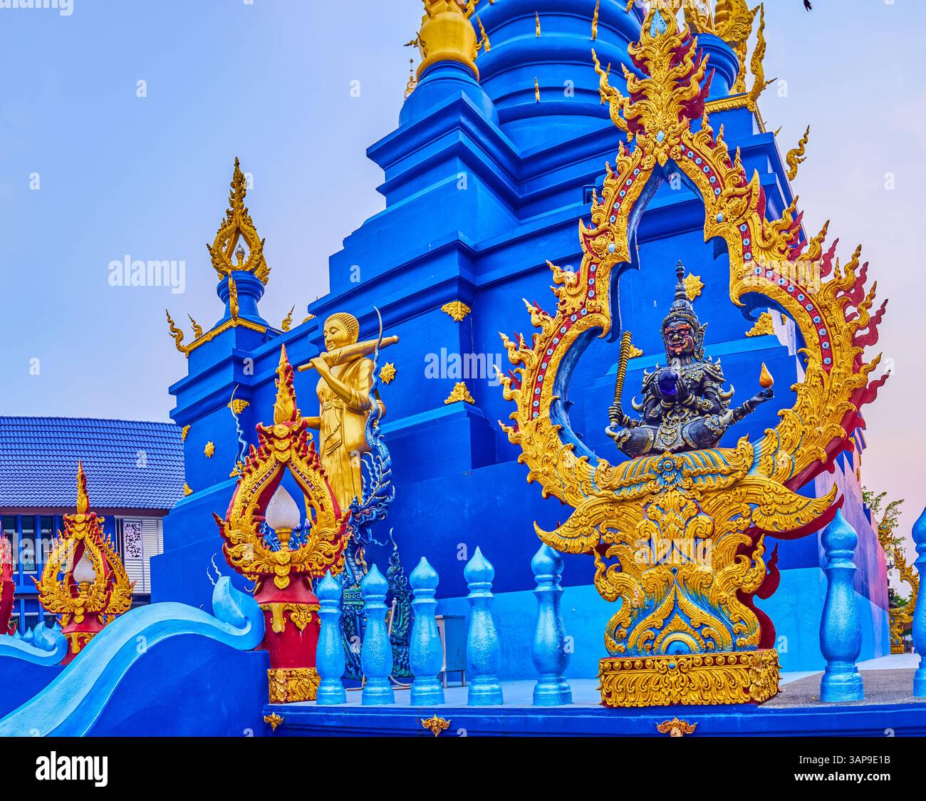 Garuda-like statue in ornate frame at the Chedi in Wat Rong Suea Ten ...