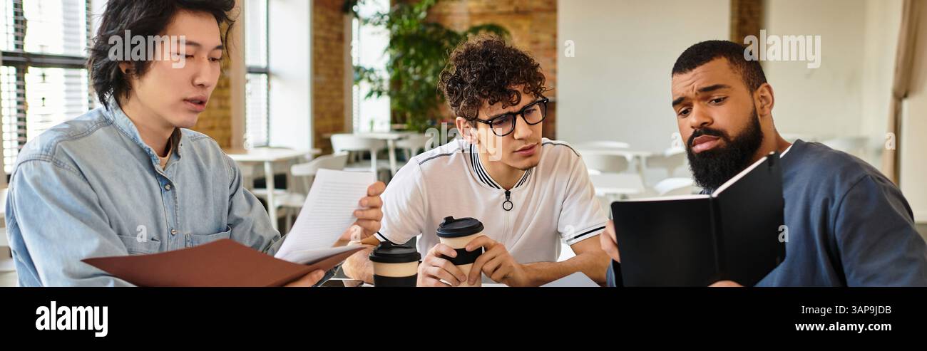 Three people share ideas and coffee in a modern workspace. Stock Photo