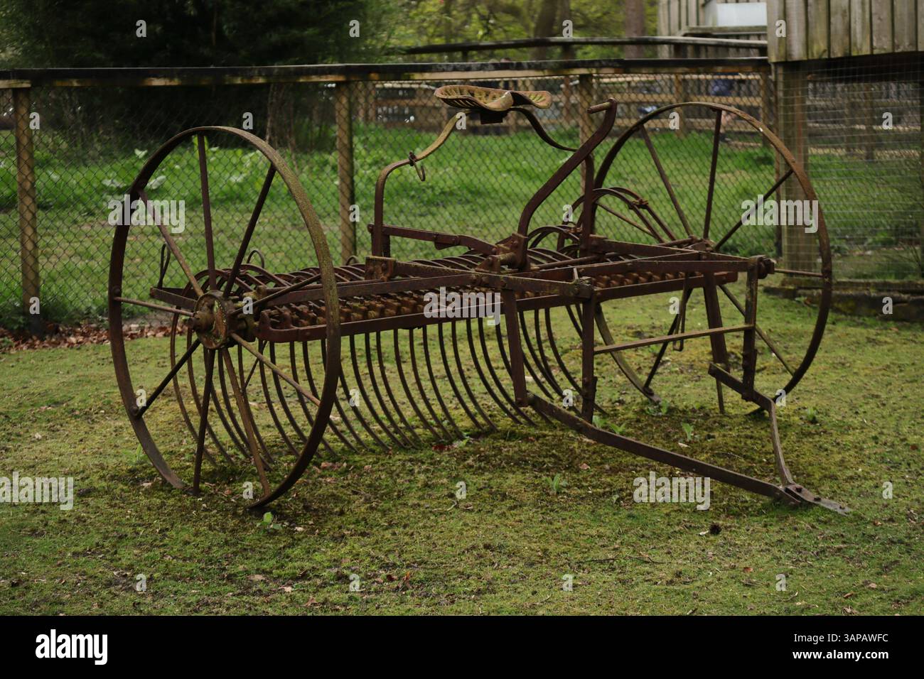 Farm equipment: A horse-drawn hay rake, a piece of historical ...