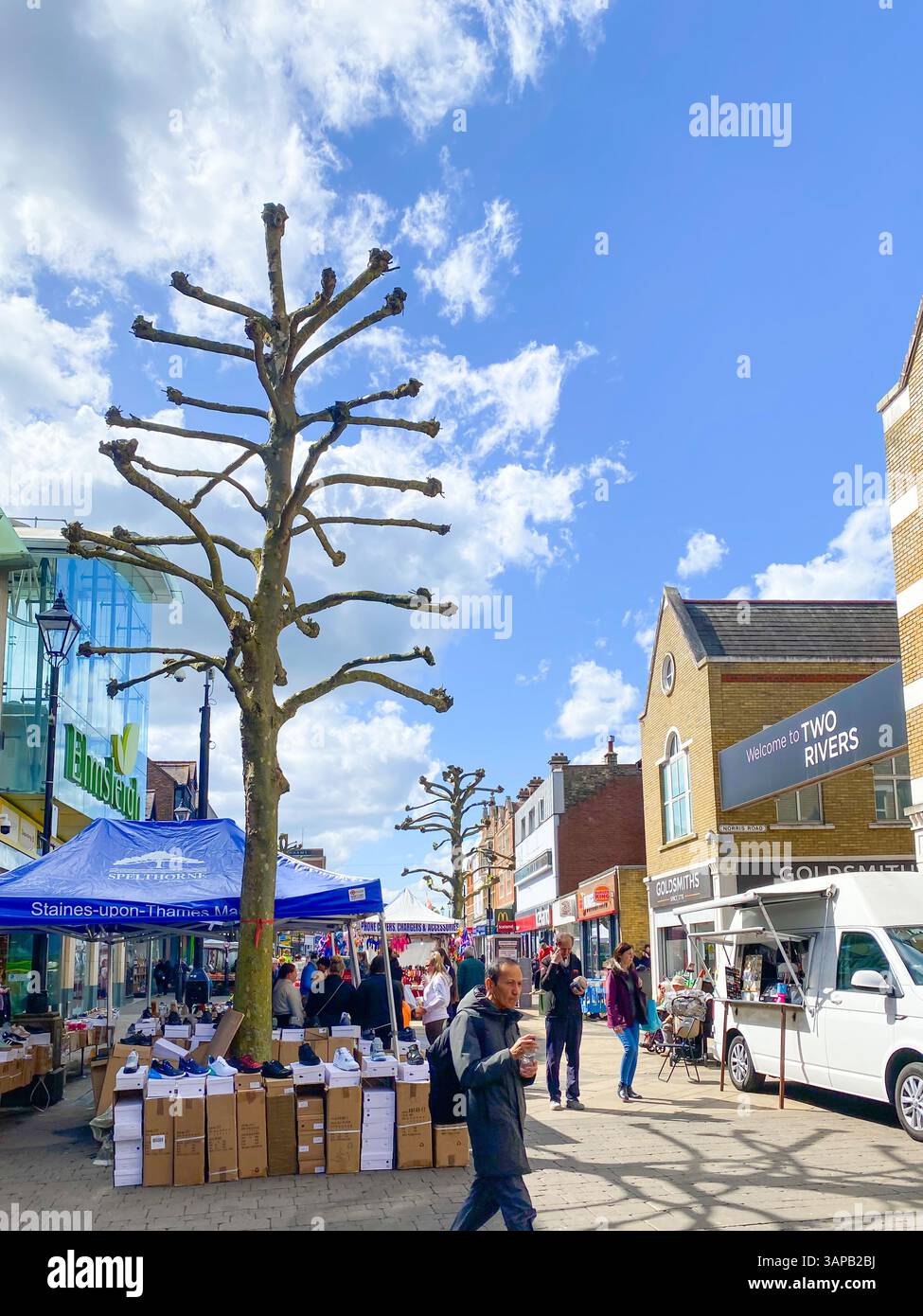 A view along The high Street in the centre of Staines-upon-Thames in Surrey, UK which is occupied by a street market. - Smartphone Captured Stock Image