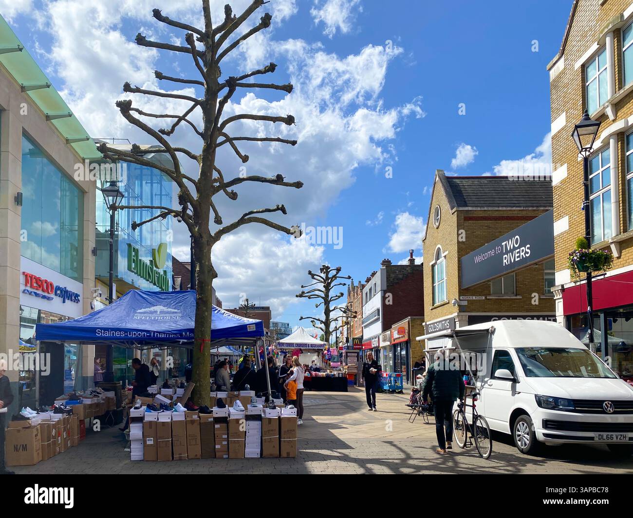 A view along The high Street in the centre of Staines-upon-Thames in Surrey, UK which is occupied by a street market. - Smartphone Captured Stock Image
