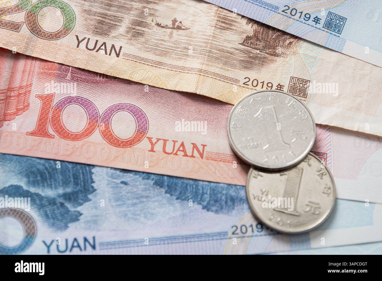 Yuang Chinese Yuan banknotes and coins, various denominations as background ...