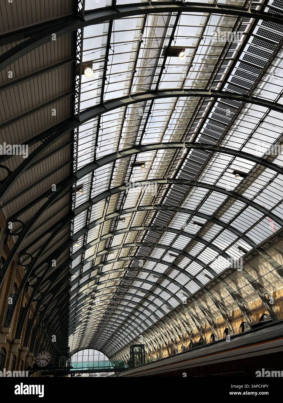 The Grandeur of the arched roof of Cubitt's Kings Cross Railway Station, London, south east England - Smartphone Captured Stock Image