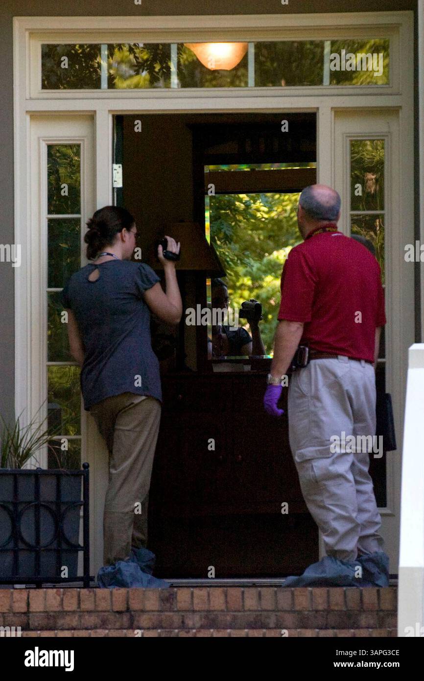 July 16, 2008 - Raleigh, North Carolina, U.S. - CCBI investigators videotape the home of Brad and Nancy Coopers on Wednesday. A search warrant was issued after autopsy report came back identifying Nancy Cooper as the body that was discovered Monday night in a pond in Cary. Cooper had been reported missing since Saturday morning when she left her Lochmere home to go running. (Credit Image: &#169; Shawn Rocco/News Observer/ZUMAPRESS.com) Stock Photo