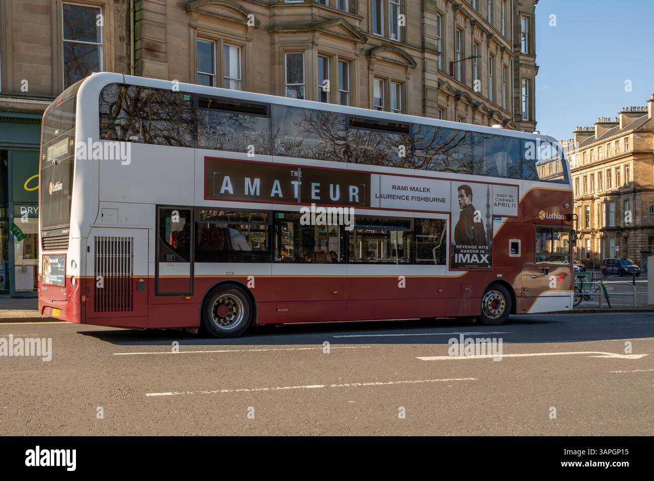 Bus in Edinburgh carrying advert for The Amateur film - Edinburgh, Scotland, UK. Stock Photo