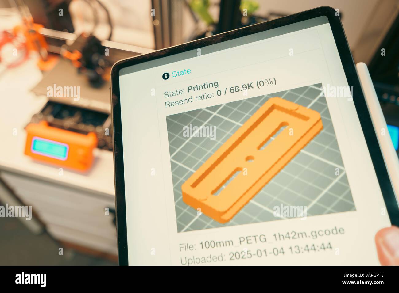 3d print slice software remote control tablet hand holding device prototype model on screen Stock Photo