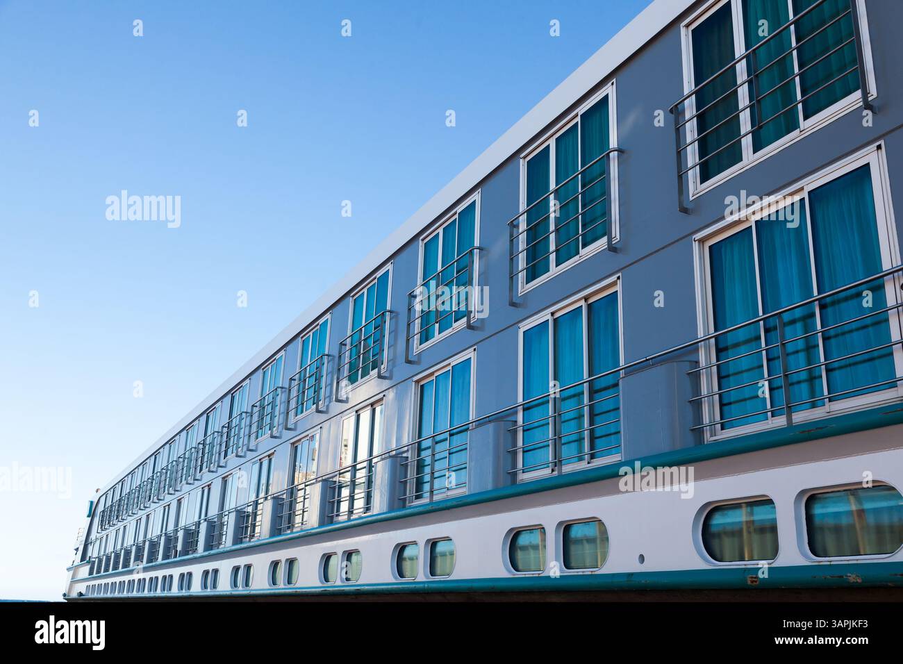 View Off Ship Side view of a river passenger ship against the sky, bottom view. River ...