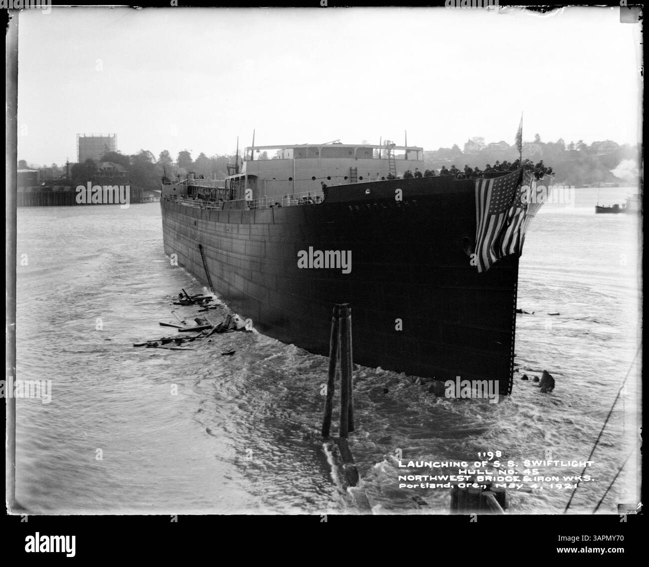 Photograph of the launching of the 'SS Swiftlight' hull no. 45 by Northwest Bridge and Ironworks, Portland, Oregon. The image shows the ship's construction process. Stock Photo