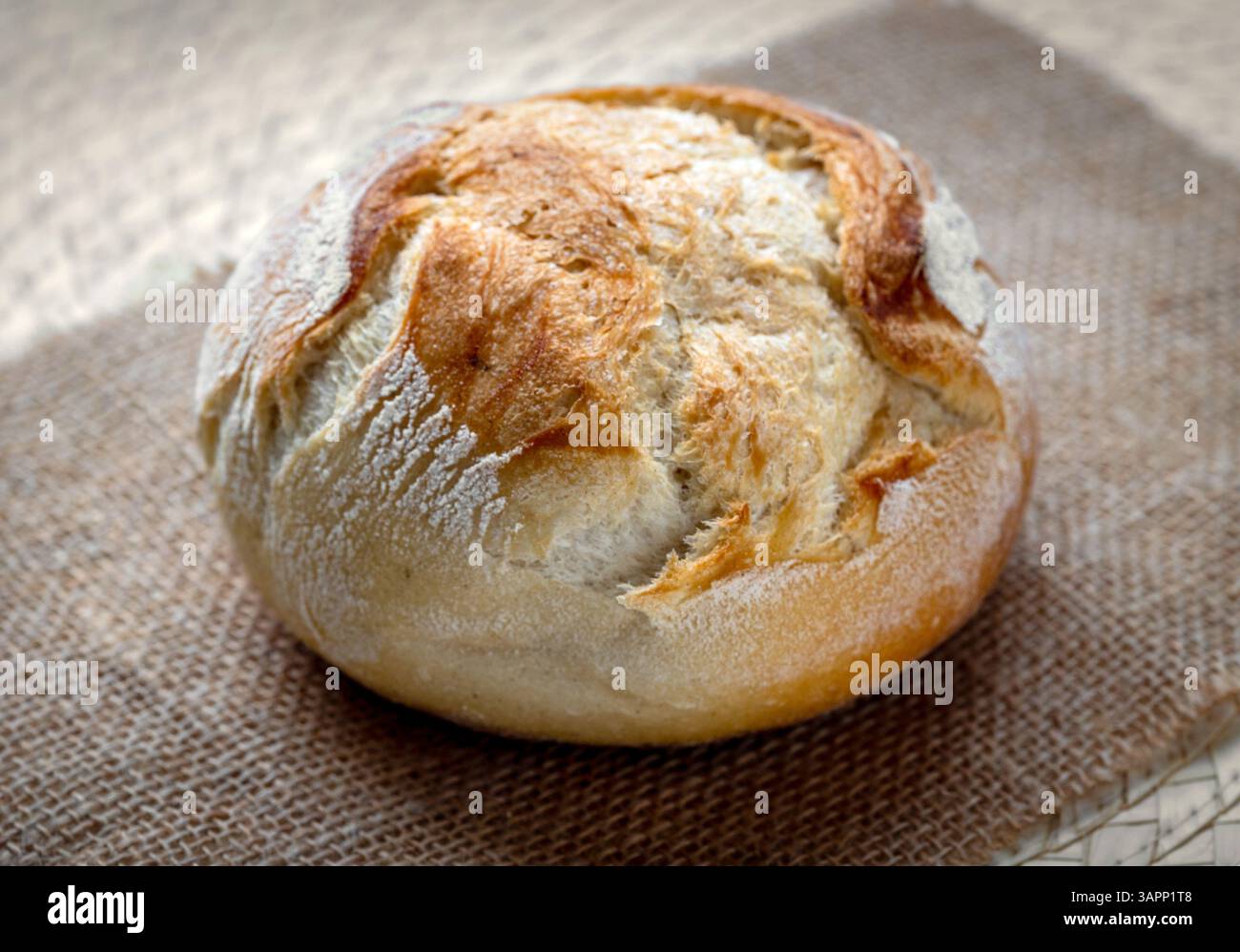 freshly baked bread on kitchen table Stock Photo