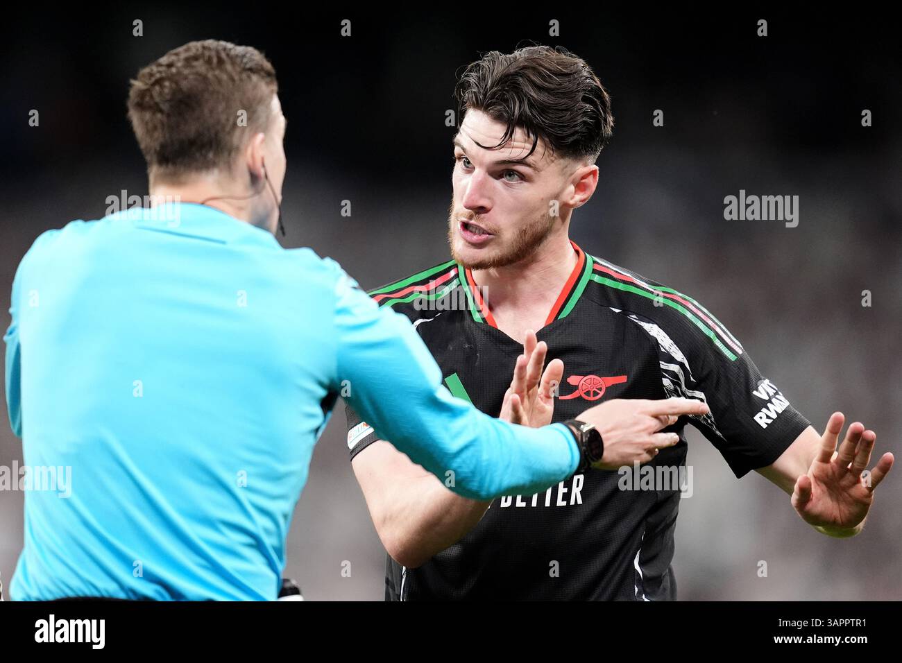 Arsenal's Declan Rice (right) speaks to referee Francois Letexier ...