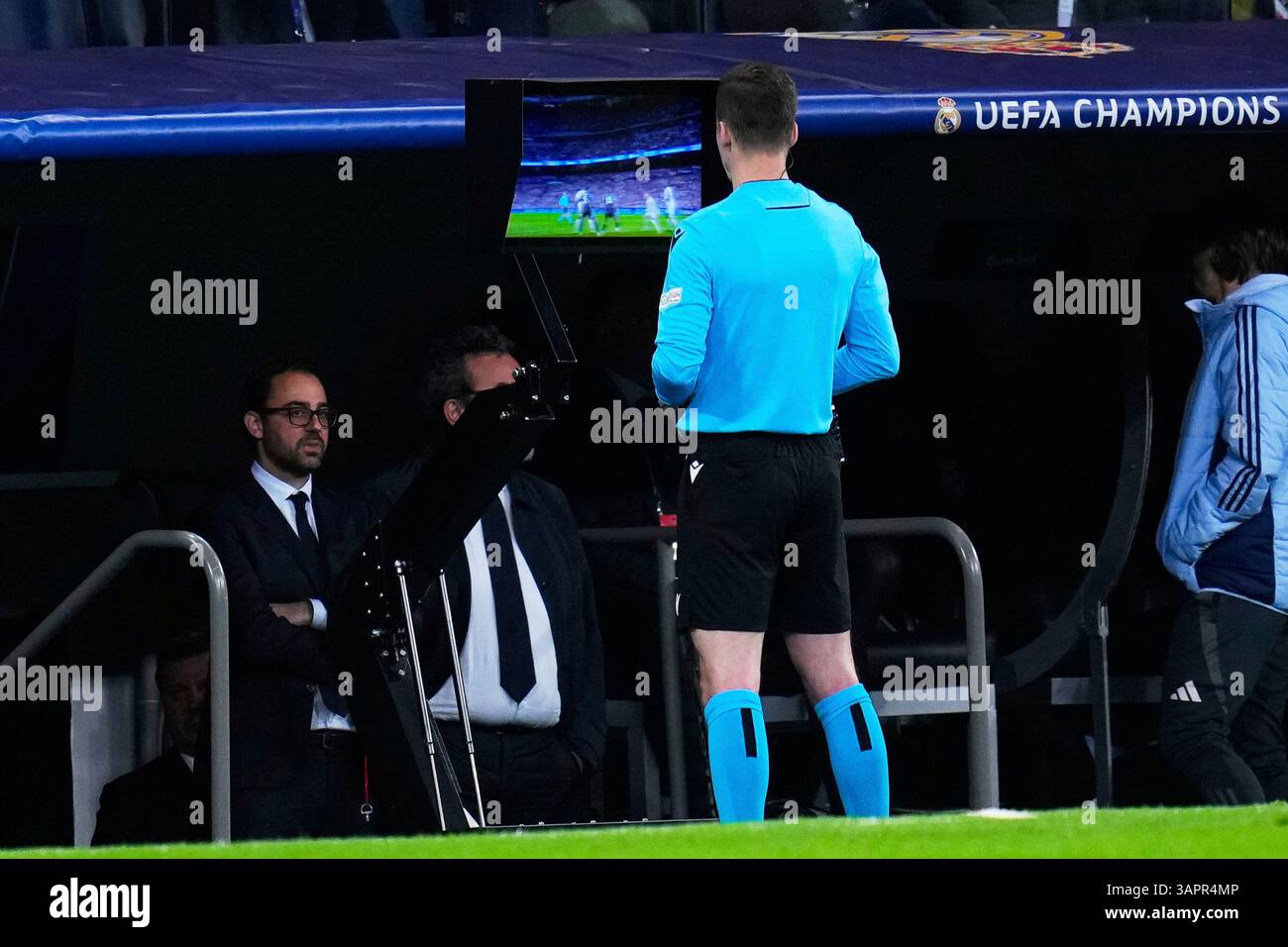 Referee Francois Letexier checks the video for a possible penalty by ...