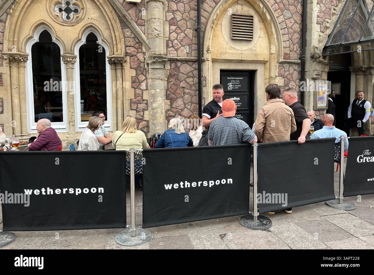 Patrons drinking outside a Wetherspoon Pub called The Great Western near Cardiff Central Railway Station. Cardiff, Wales, United Kingdom. - Smartphone Captured Stock Image Patrons drinking outside a Wetherspoon Pub called The Great Western near Cardiff Central Railway Station. Cardiff, Wales, United Kingdom. - Smartphone Captured Stock Image
