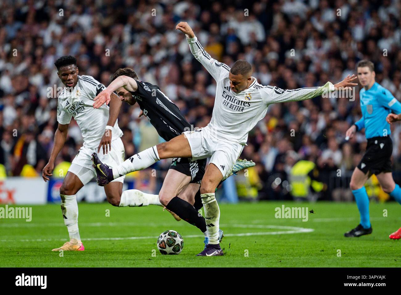 Madrid, Spain. 16th Apr, 2025. Kylian Mbappe of Real Madrid CF (R) is ...