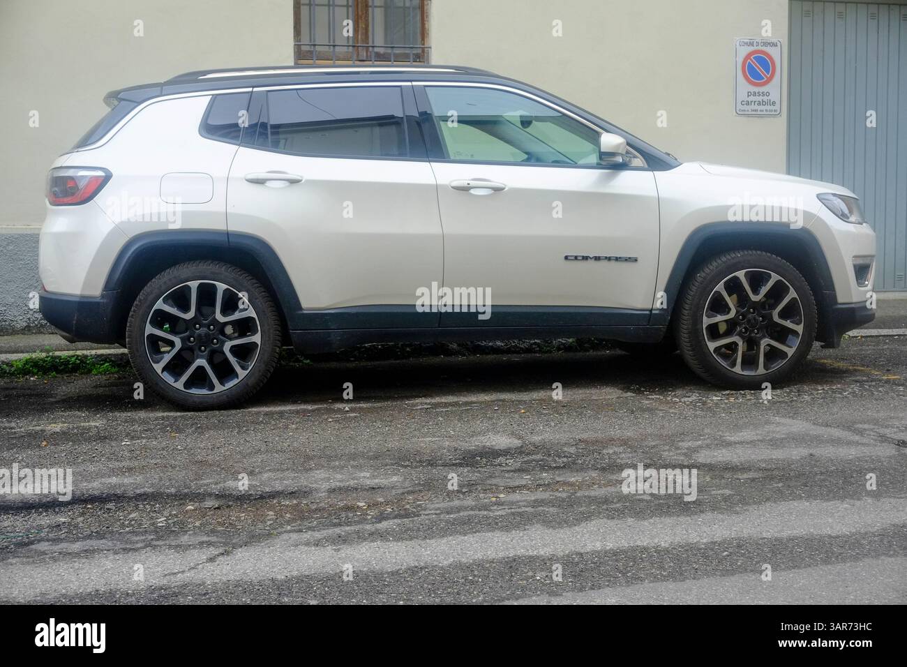 cremona-italy-april-15th-2025-side-view-of-a-white-jeep-compass-parked