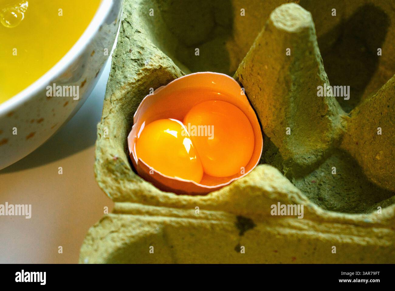 Double egg yolk in an egg Stock Photo