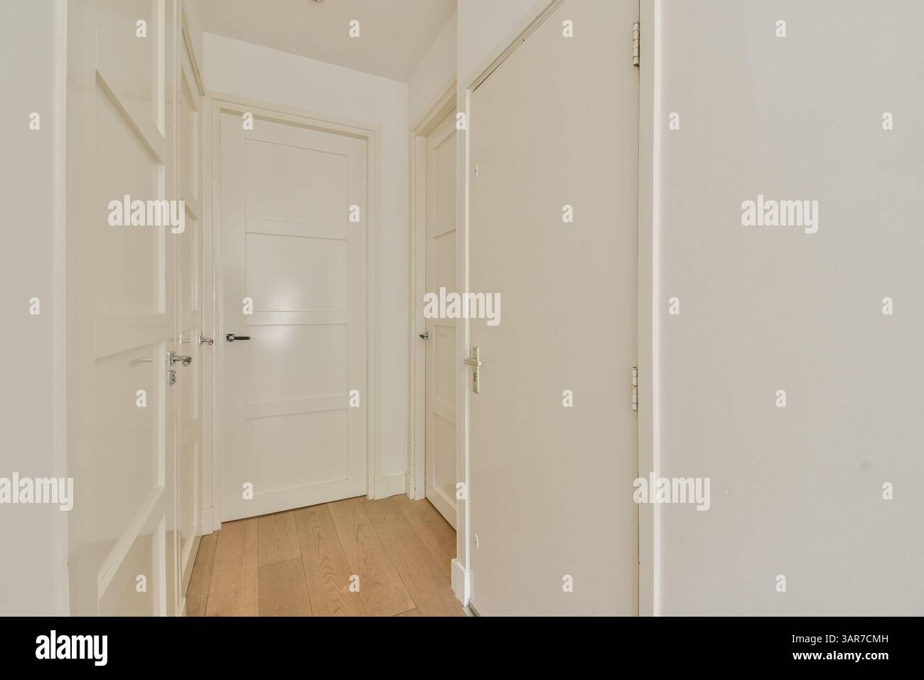 A sleek and modern hallway featuring clean lines and a neutral color ...
