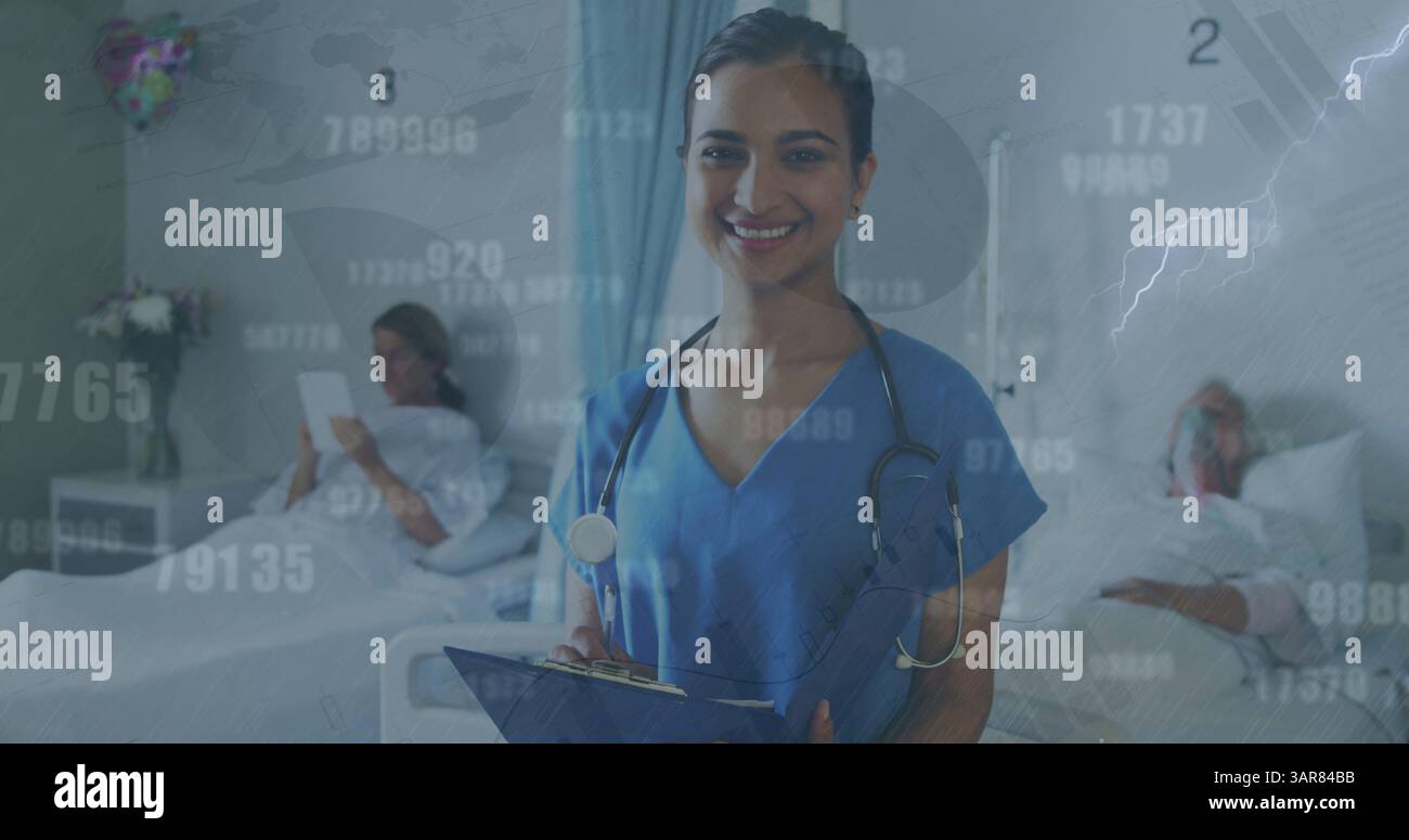 Image of numbers and data processing over biracial female doctor with patients Stock Photo