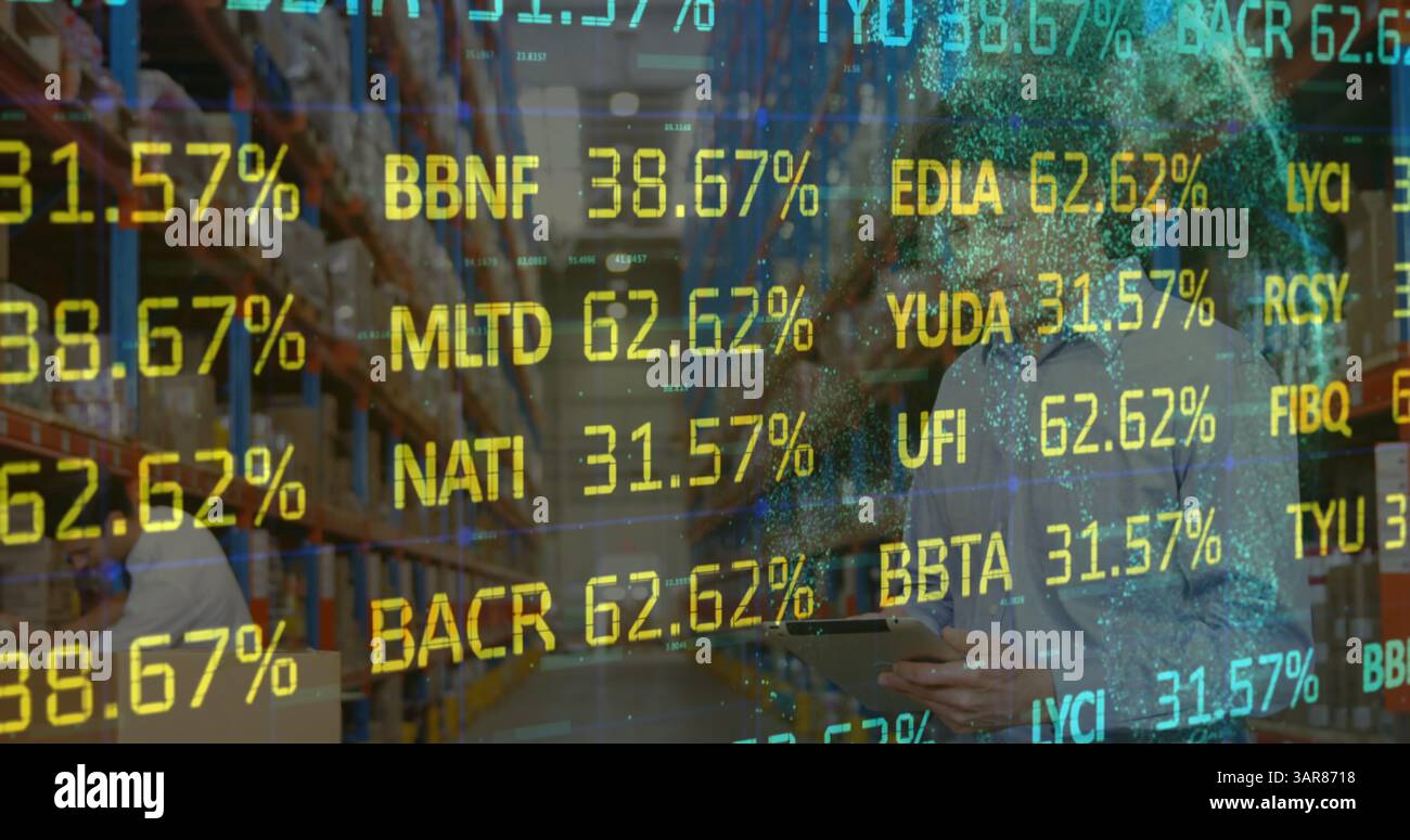Image of financial data processing over man with tablet working in warehouse Stock Photo