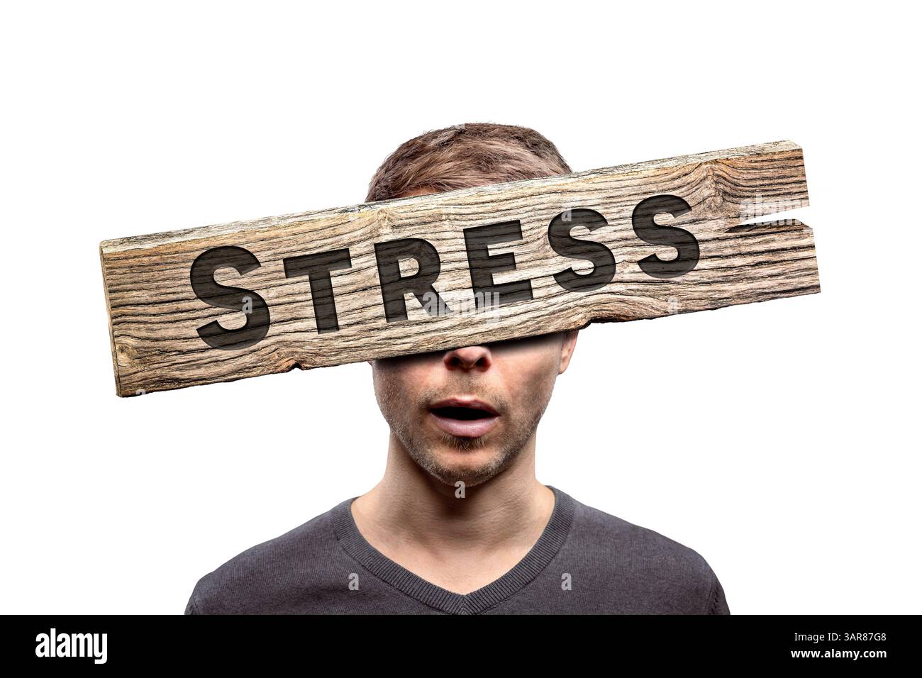 Wooden stress sign in front of a person's face Stock Photo