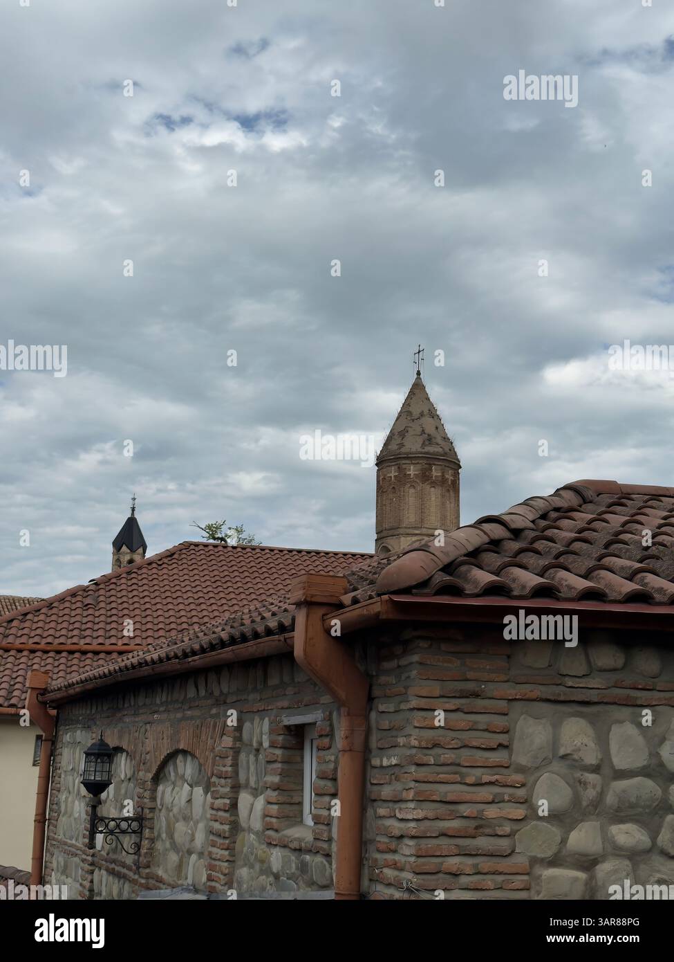 Picturesque landscape of Kakheti, Sighnaghi. Ancient stone tower. Red tiled roofs. Georgia tourism - Smartphone Captured Stock Image
