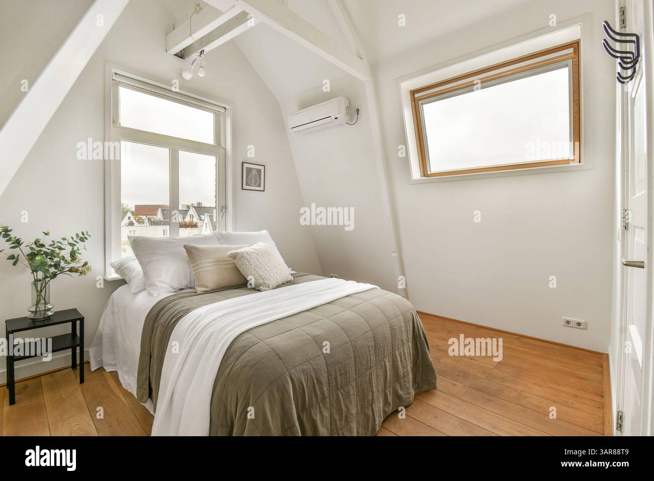 A beautifully designed modern bedroom featuring a serene color palette ...