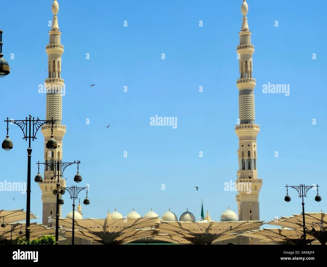 The domes and minarets of The Prophet's Mosque or Al Masjid Al Nabawi ...