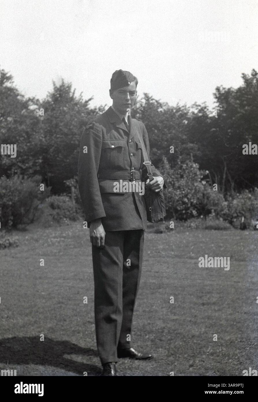 1950s-historical-a-soldier-standing-with-his-shoulder-bag-stock-photo