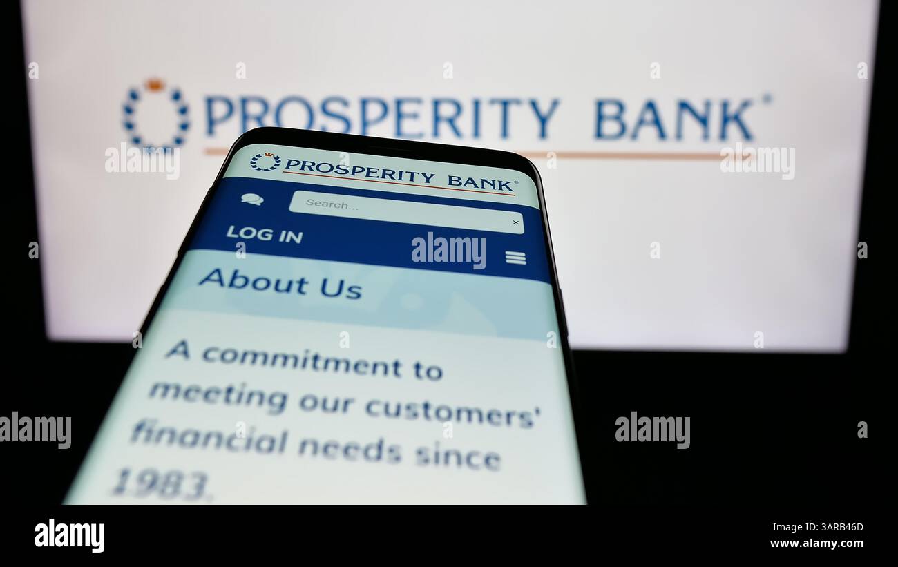Stuttgart, Germany - 12-13-2024: Mobile phone with website of US banking company Prosperity Bancshares Inc. on screen in front of business logo. Stock Photo