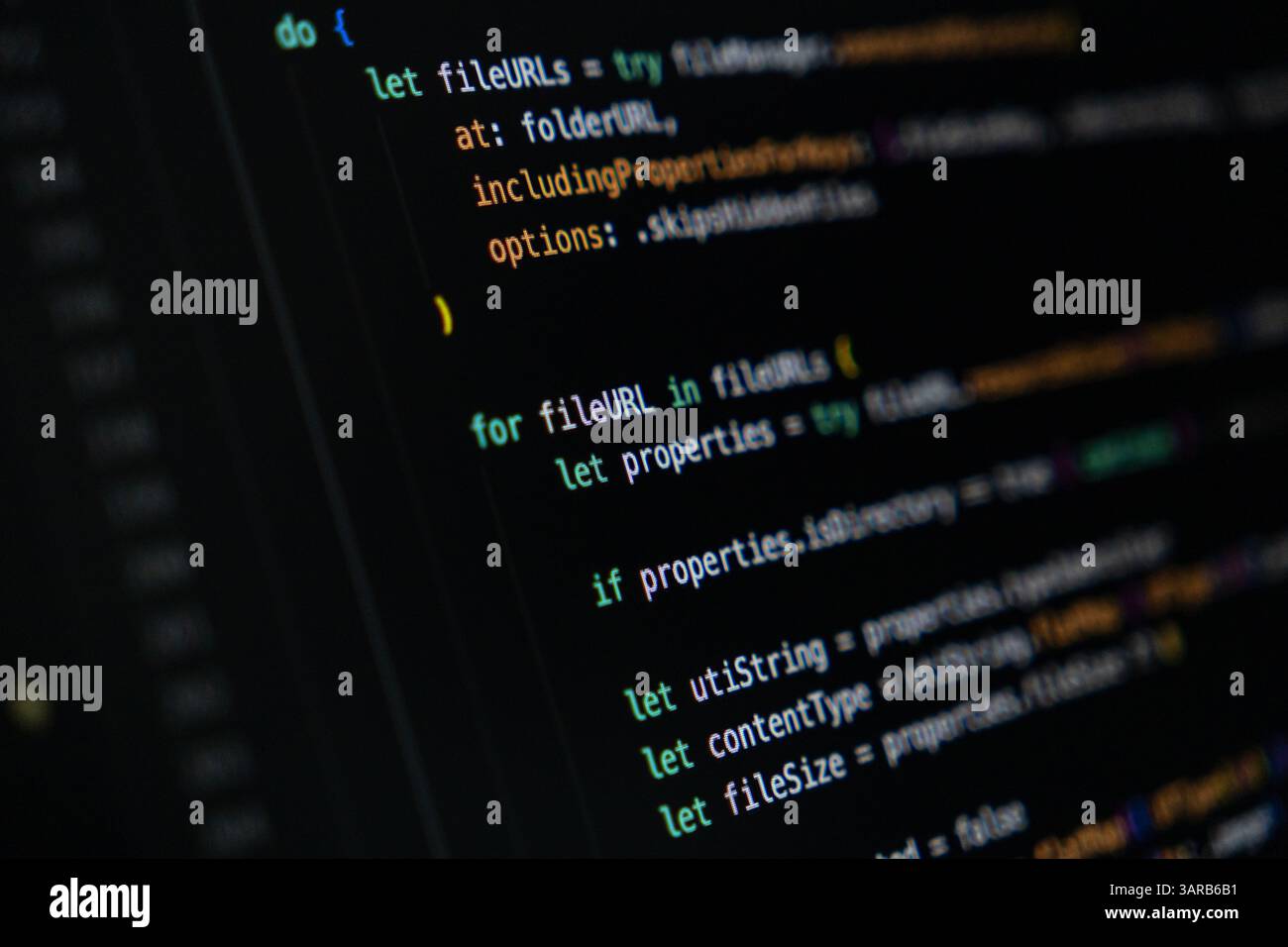 Close-up of Swift programming code on dark screen displaying loop and conditional logic for file management, reading file properties like size, type, Stock Photo