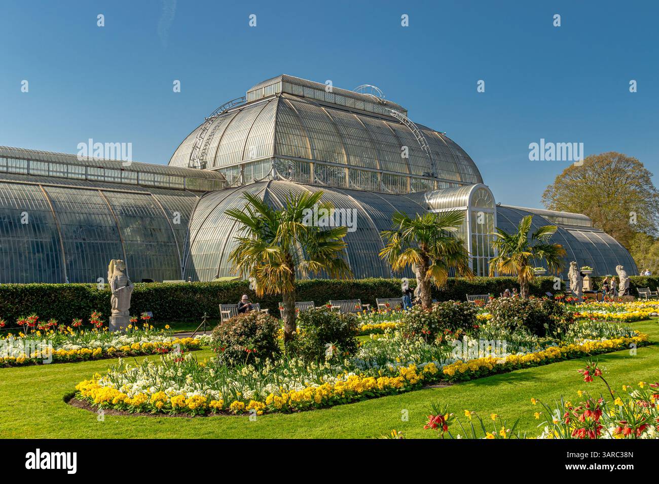 Flower beds in front of the The Palm House At The Royal Botanic Gardens, Kew ,London ,UK Stock Photo