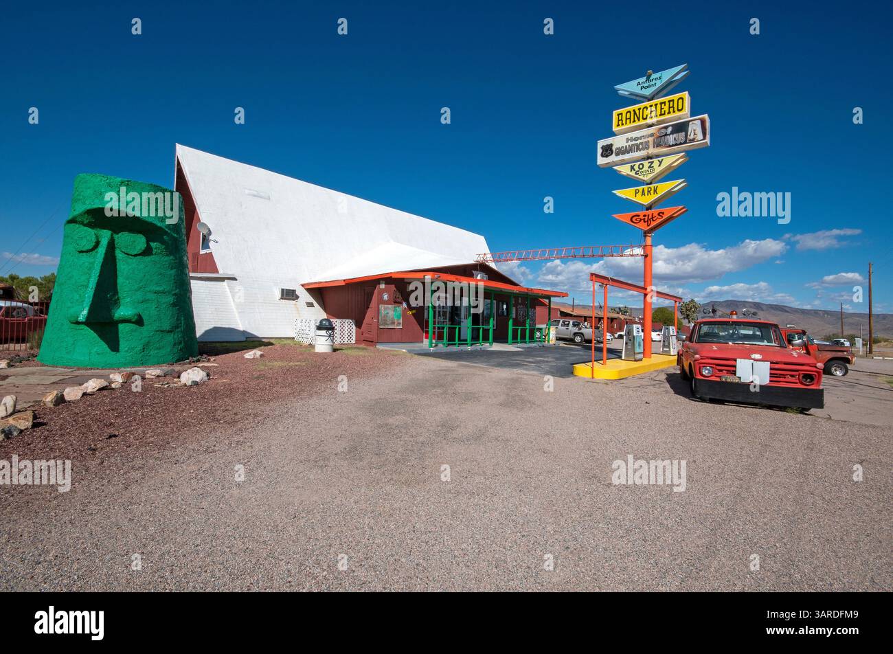 Antares Point, former gas station and store along the Route 66 (on the left Giganticus Headicus sculpture, by Gregg Arnold), Antares, Arizona, USA Stock Photo