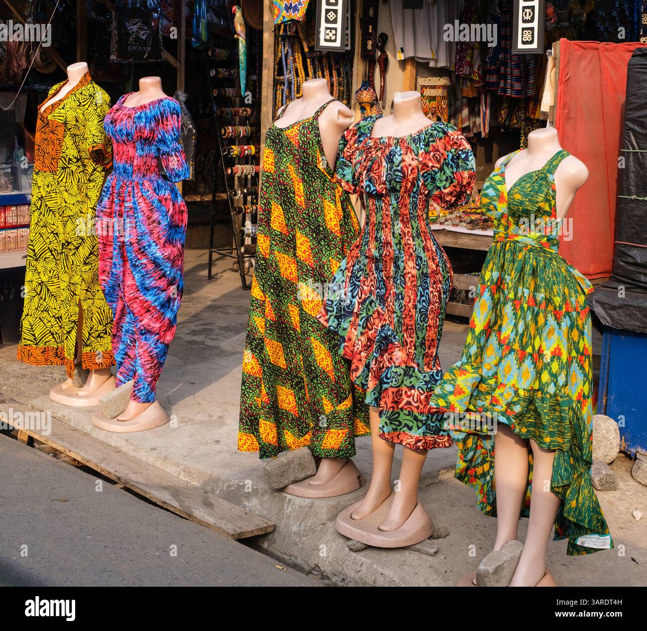 Accra Ghana Colorful Dresses Being Displayed On The Street Stock accra-ghana-colorful-dresses-being-displayed-on-the-street-stock