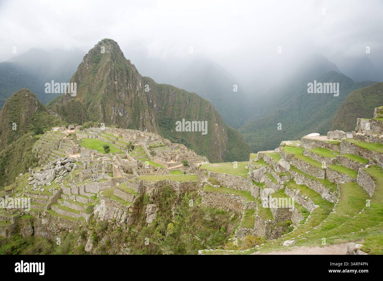 Glass Of Peruvian Pisco With A Stunning View Of Machu Picchu At Sunrise From A Luxury Hotel
