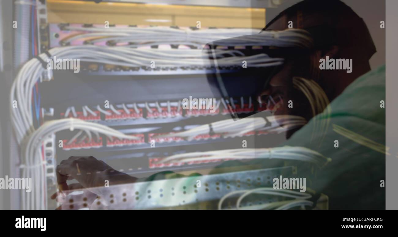 Image of men using vr headset over server room Stock Photo