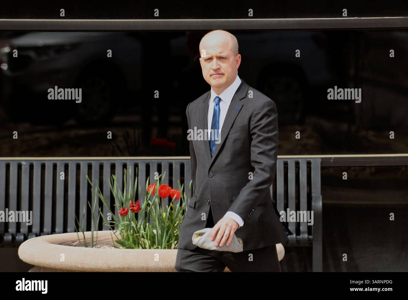 District Attorney Brian Mason walks out of court following the murder