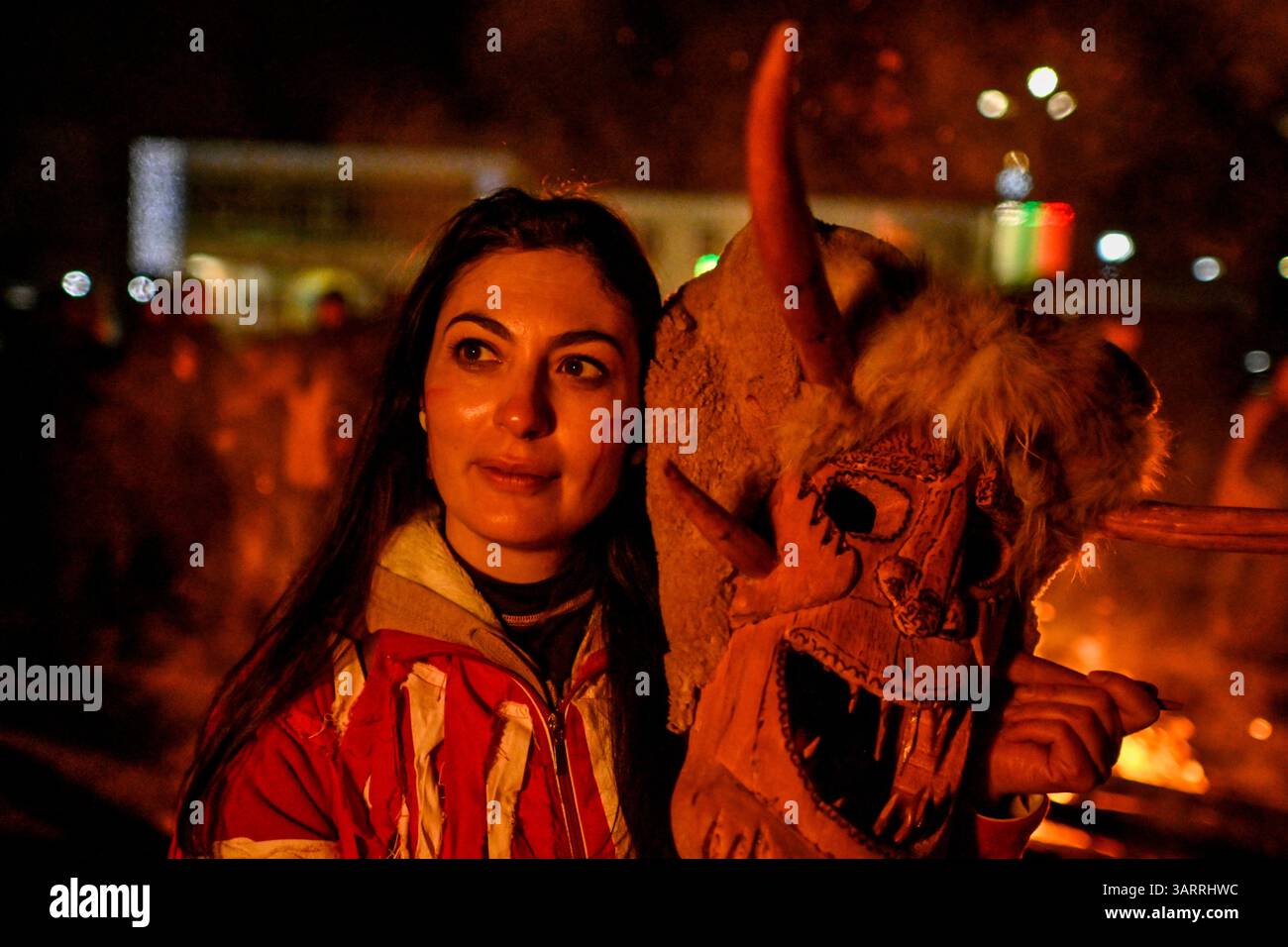 As night falls over Breznik, the Kukeri gather around a roaring ...