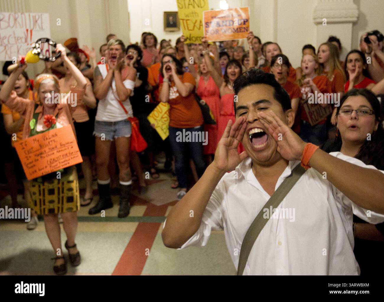 Nov. 19, 2013 - The Supreme Court on Tuesday allowed Texas to continue enforcing abortion restrictions that opponents say have led more than a third of the state's clinics to stop providing abortions. PICTURED: July 12, 2013 - Austin, Texas, U.S. - DAVE CORTEZ, right, and other abortion rights advocates make their voices heard outside the Senate Chamber at the Capitol in Austin, Texas, during the debate of abortion restriction bill, House Bill 2. (Credit Image: © Jay Janner/MCT/ZUMAPRESS.com) Stock Photo