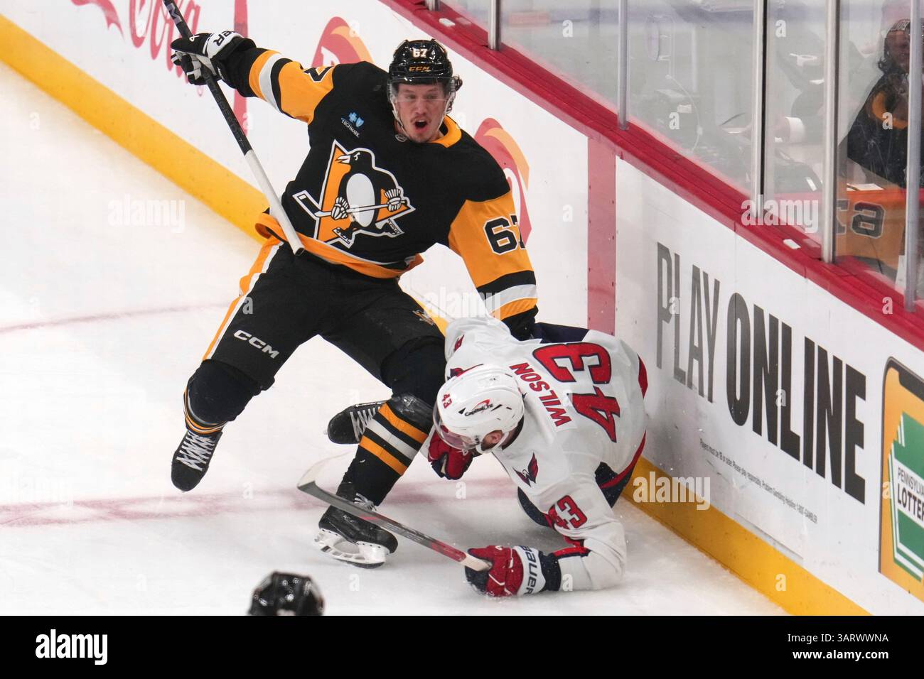 Pittsburgh Penguins' Rickard Rakell (67) collides with Washington ...