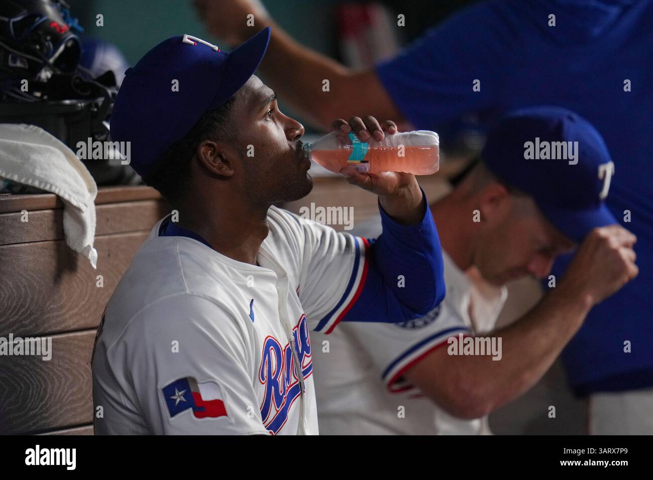 Texas Rangers starting pitcher Kumar Rocker rests in the dugout during ...