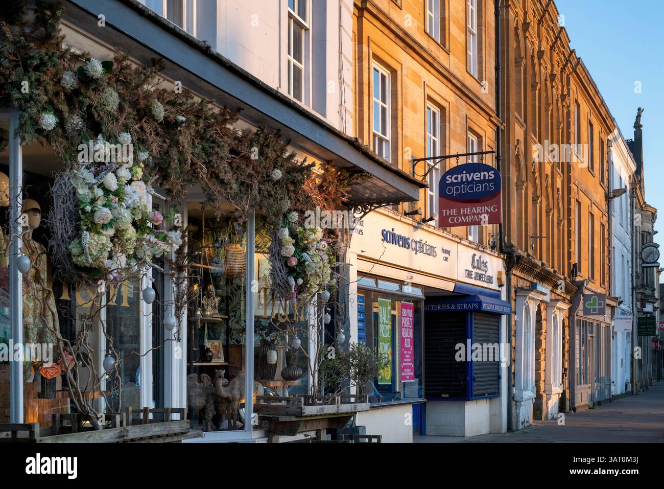 High Street buildings in the evening sunlight. Chipping Norton, Oxfordshire, England Stock Photo