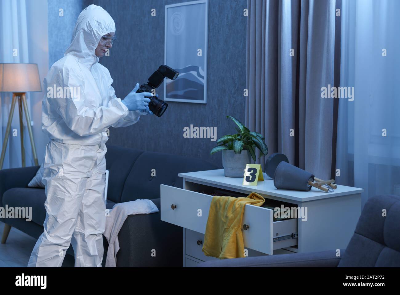 Forensic expert with camera working at crime scene in messy room Stock ...