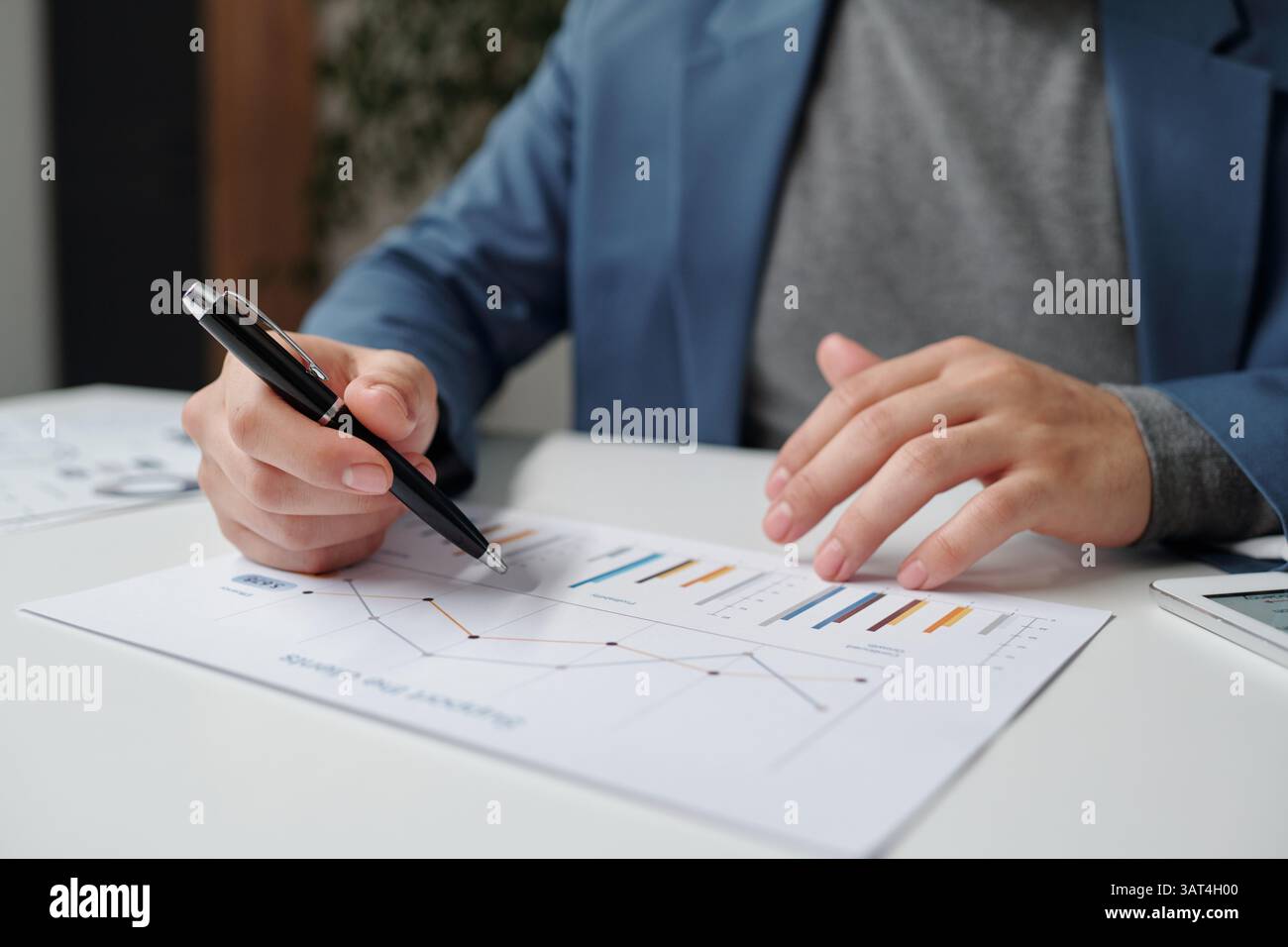 Man Analyzing Data Report Stock Photo