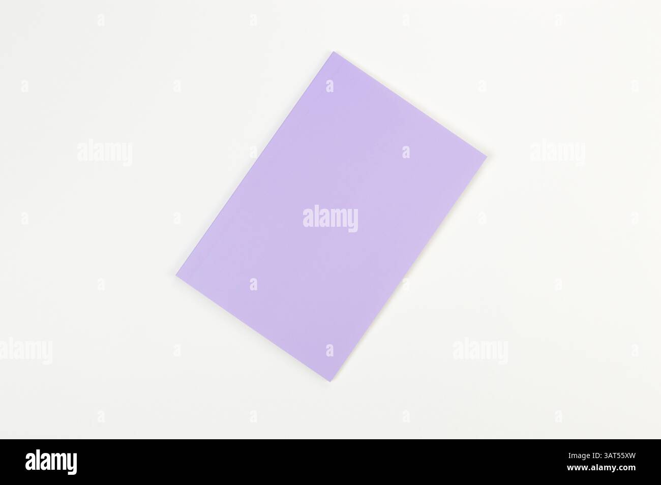 Top view of purple notebook on white background. School, office wallpaper. Flat lay, copy space. Stock Photo