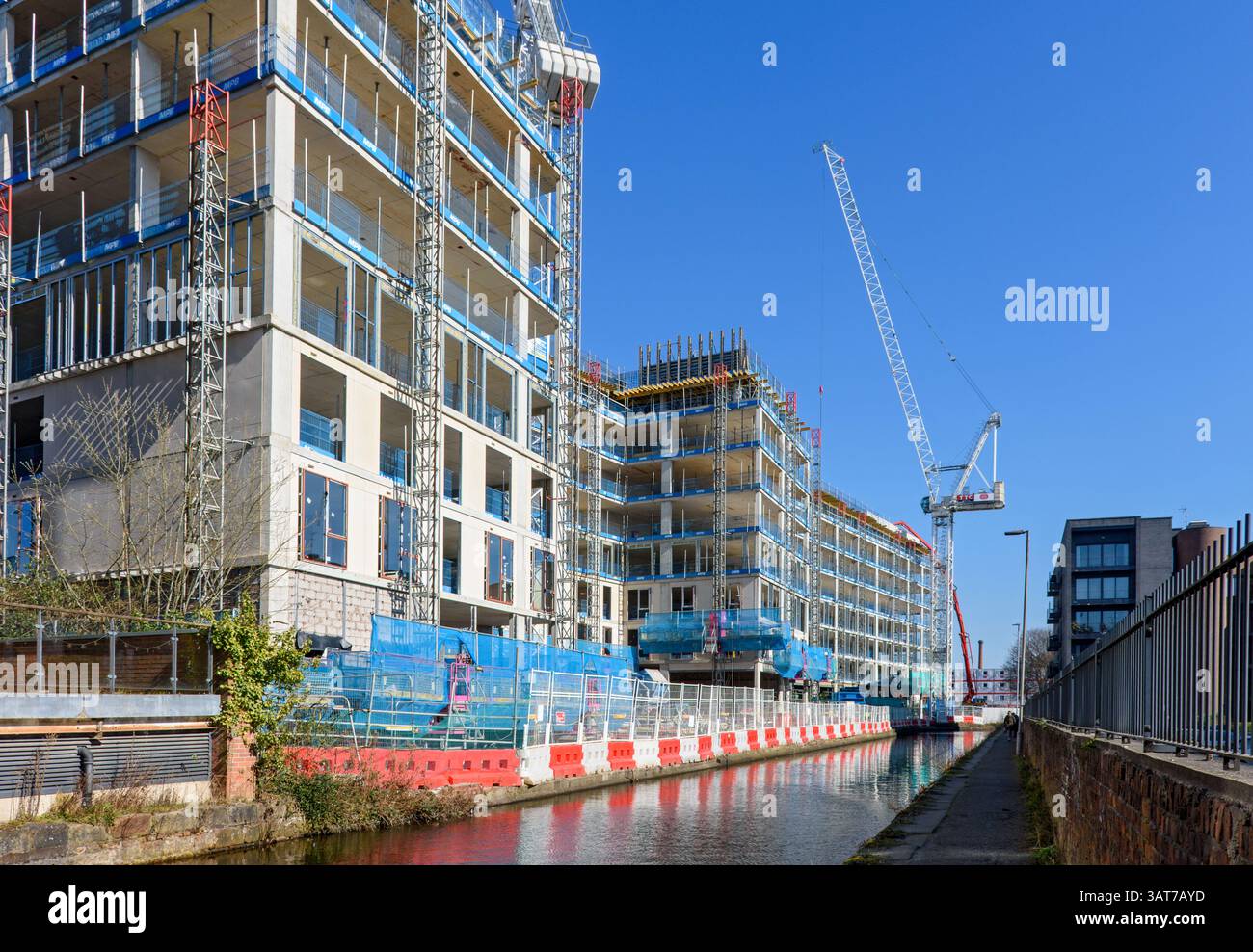 The Jersey Wharf apartment blocks, under construction, March 2025.  Alongside the Rochdale Canal, Ancoats, Manchester, England, UK Stock Photo